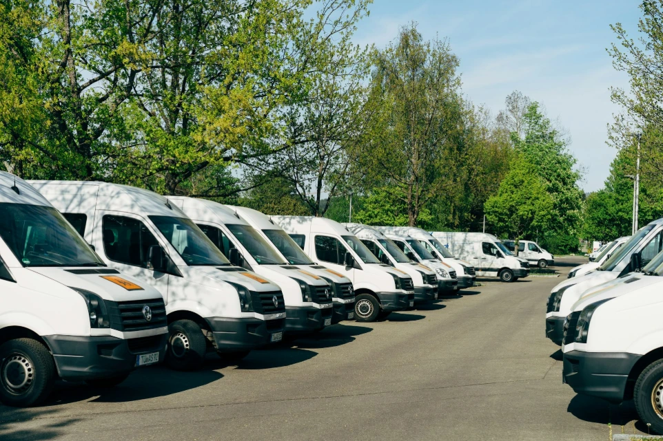 A row of white vans parked in a lot in Mössingen, Germany
